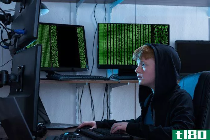 teen hacker using multiple computers