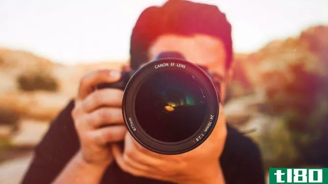 Photographer Taking Shot Canon EF Lens
