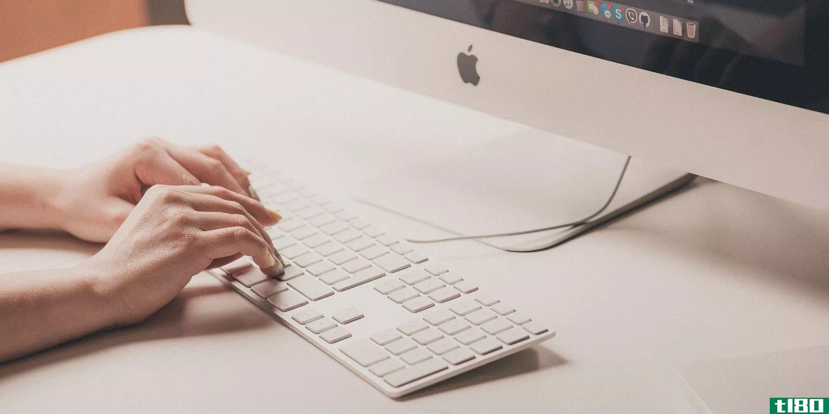 Person typing on Apple keyboard