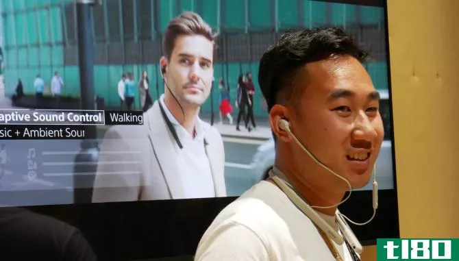 Sonly employee wearing the Sony WI-1000XM2 headphones at IFA 2019.