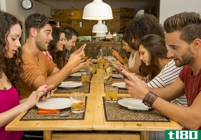 Group of people using their phones
