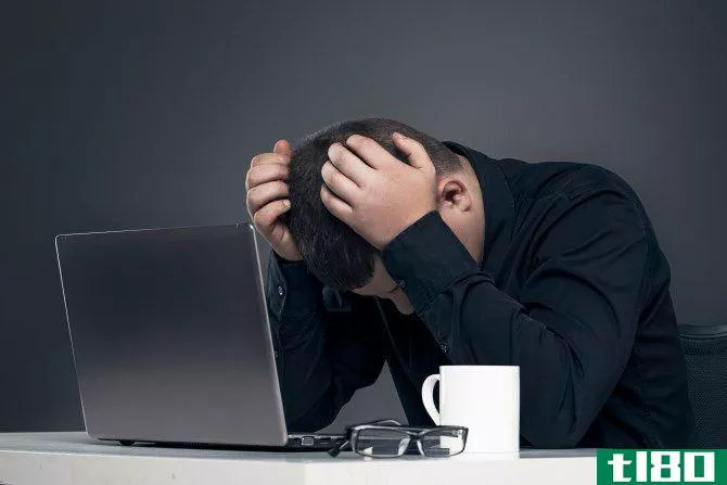 Man depressed with computer