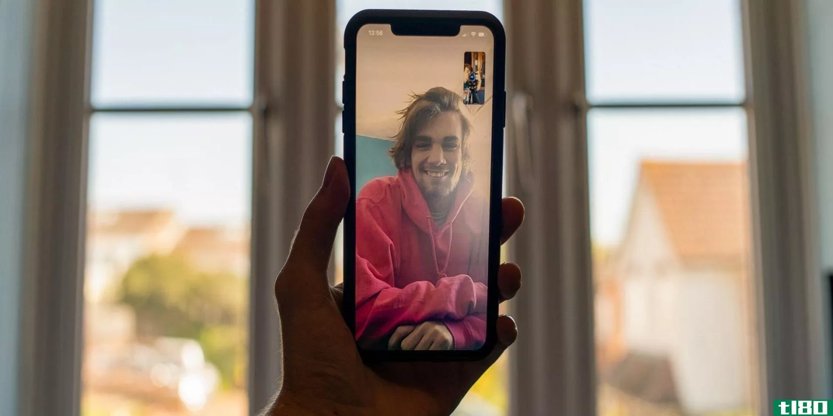 Hand holding a **art phone in a video call