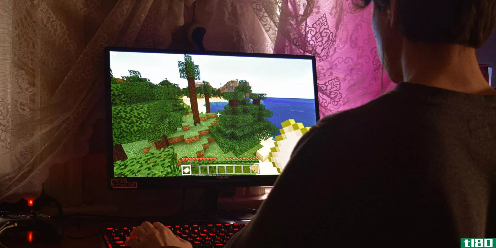 A guy playing games on a PC featured