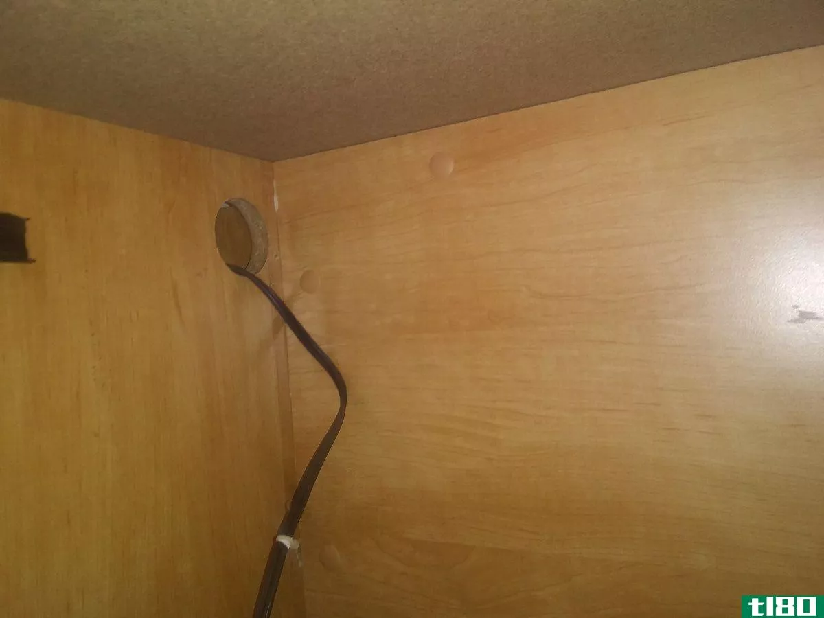 Check old desks for cable ports in cabinets.,