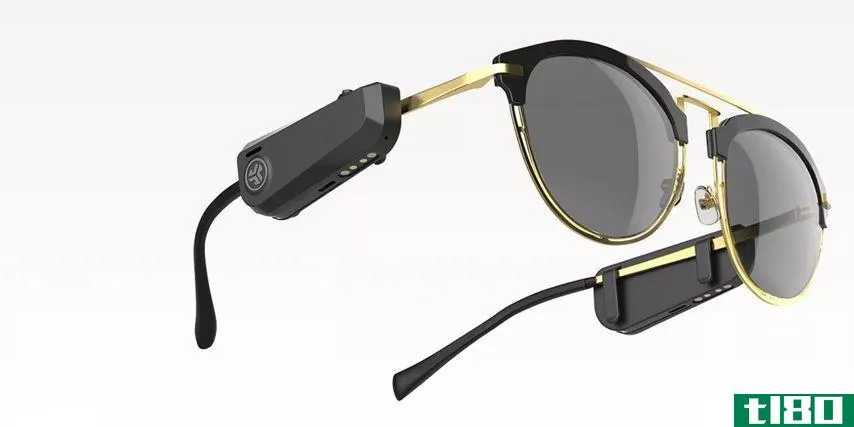 JLab Audio JBuds Frames clipped onto sunglasses with golden frame.