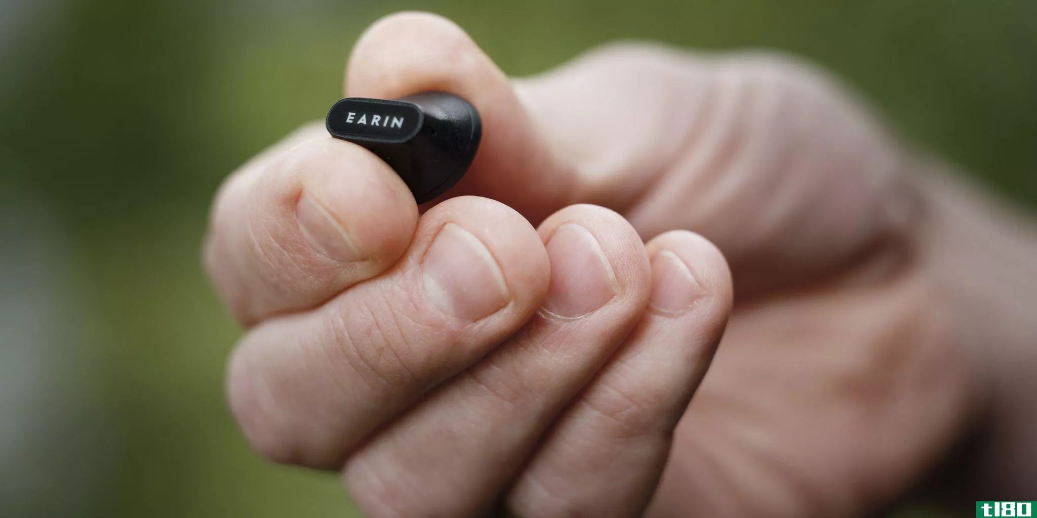 Earin A-3 earbud held in hand.