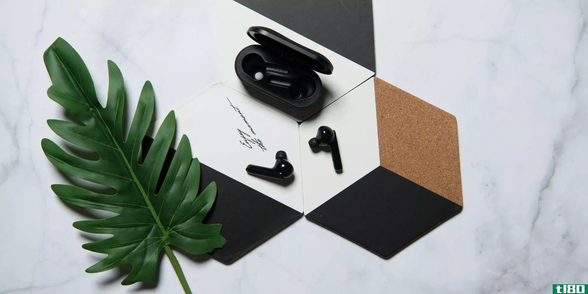 Mobvoi Earbuds Gesture earbuds with case on decorative tiles