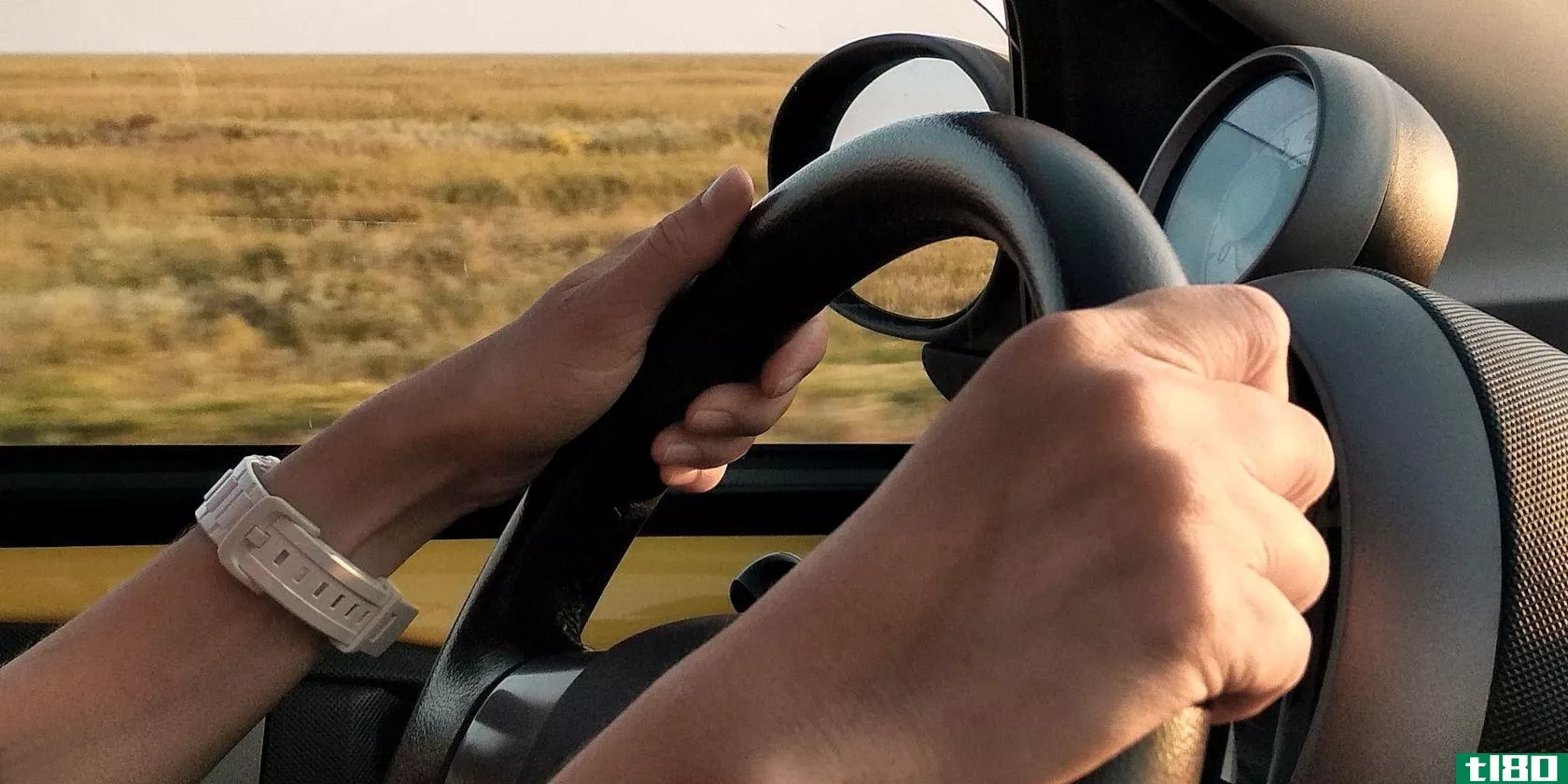 Female Hands on Steering Wheel While Driving