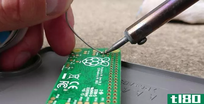Soldering the header pins to the composite video on Raspberry Pi Zero