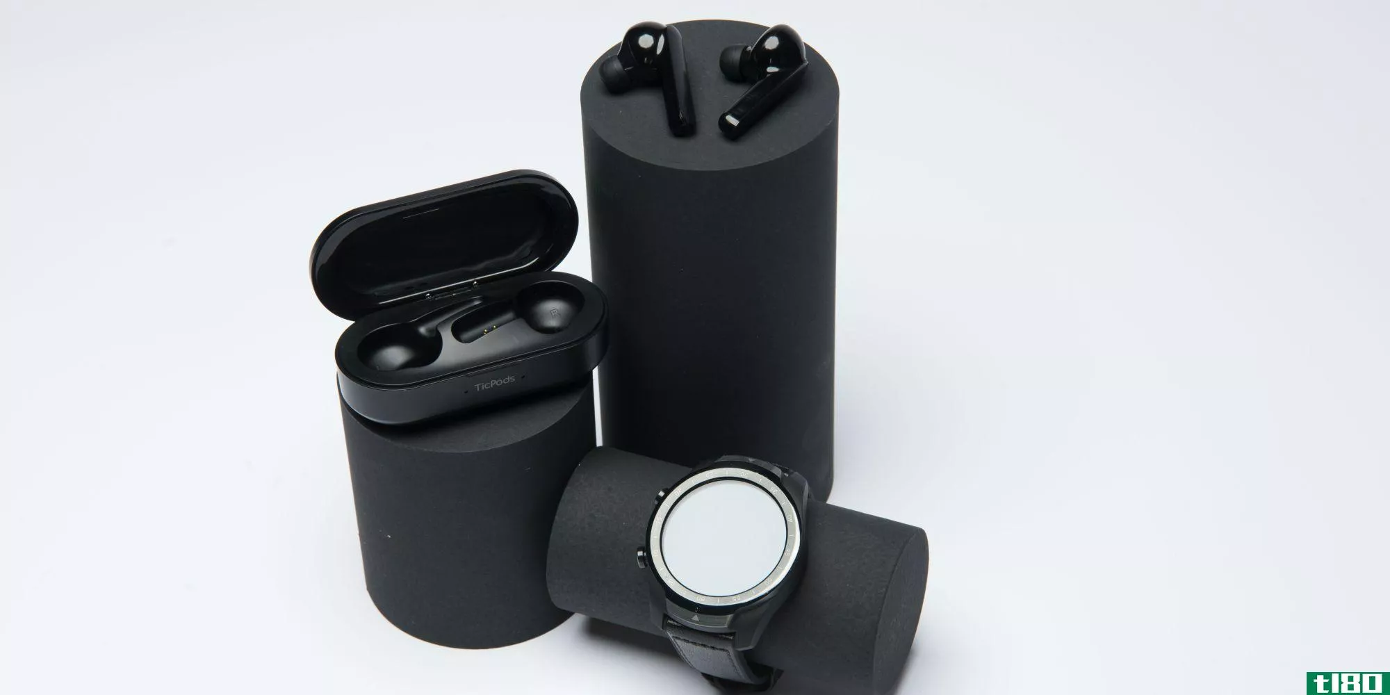 Mobvoi Earbuds Gesture earbuds with case and watch on display posts
