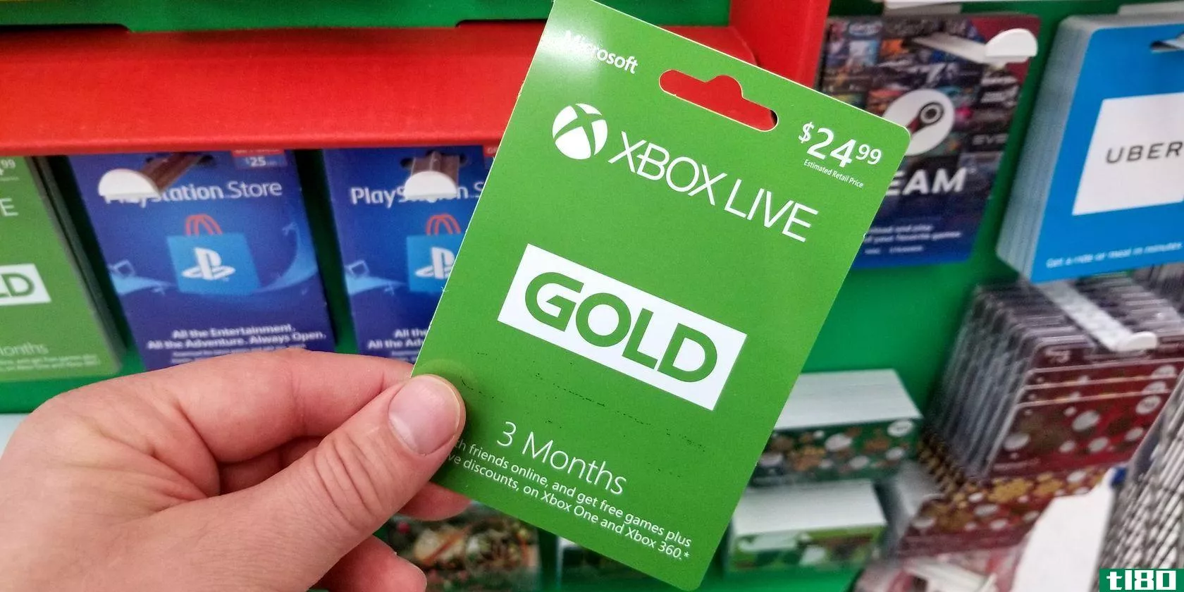 Someone holding an Xbox Live Gold card