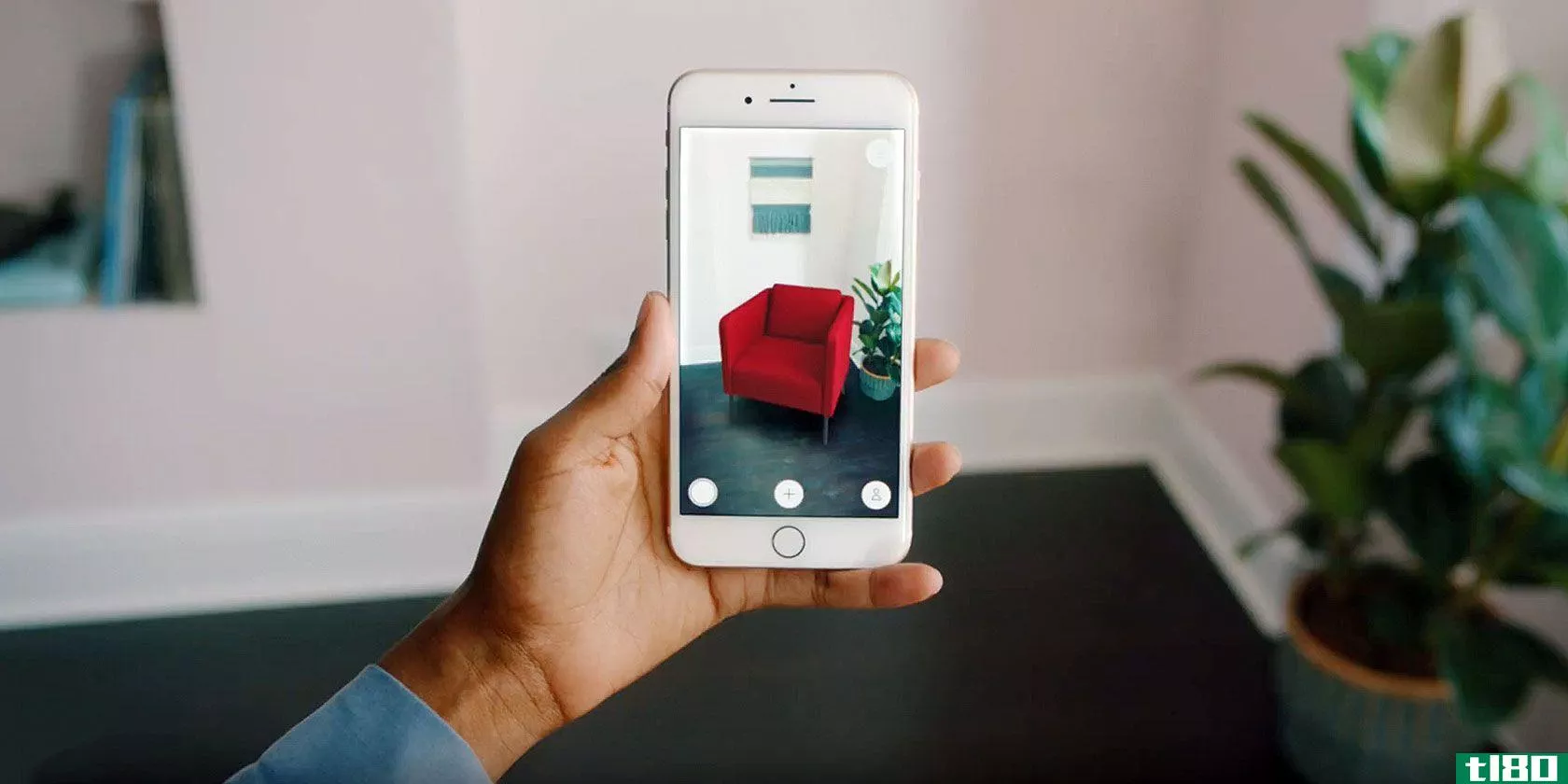 A photograph showing a furniture-placement augmented reality app on an iPhone
