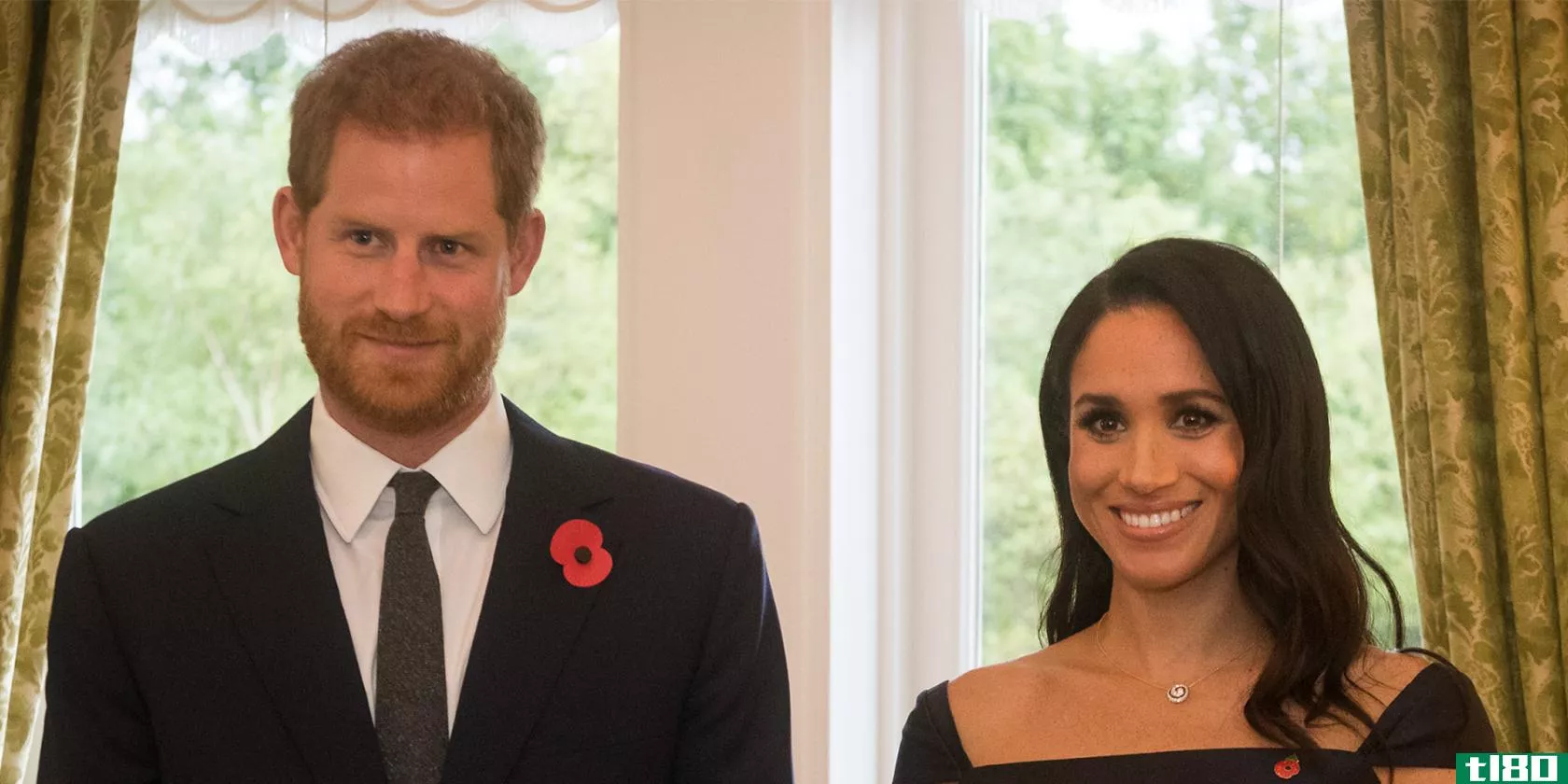 Prince Harry and Meghan Markle **ile for a formal photo