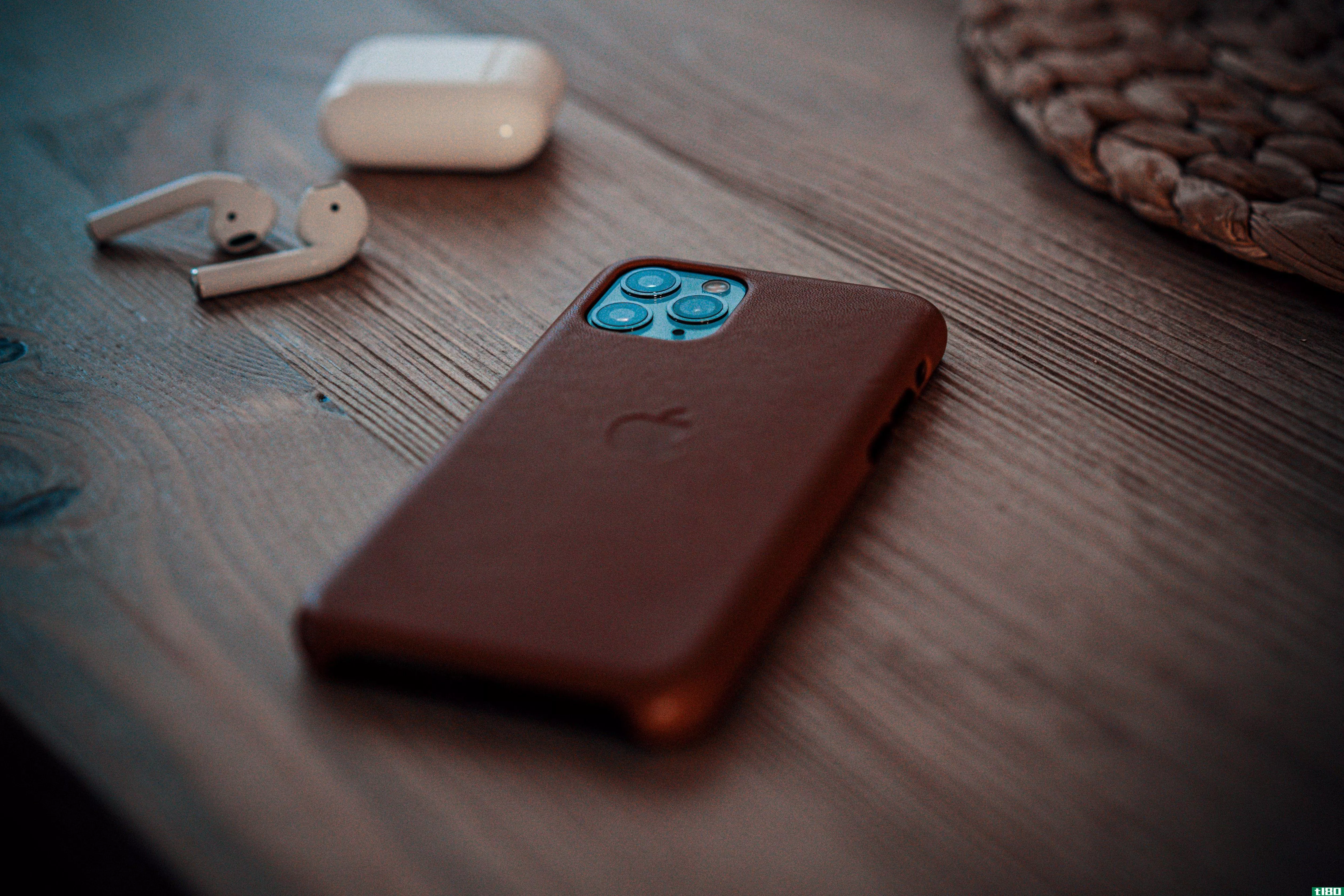 an iPhone in a leather case