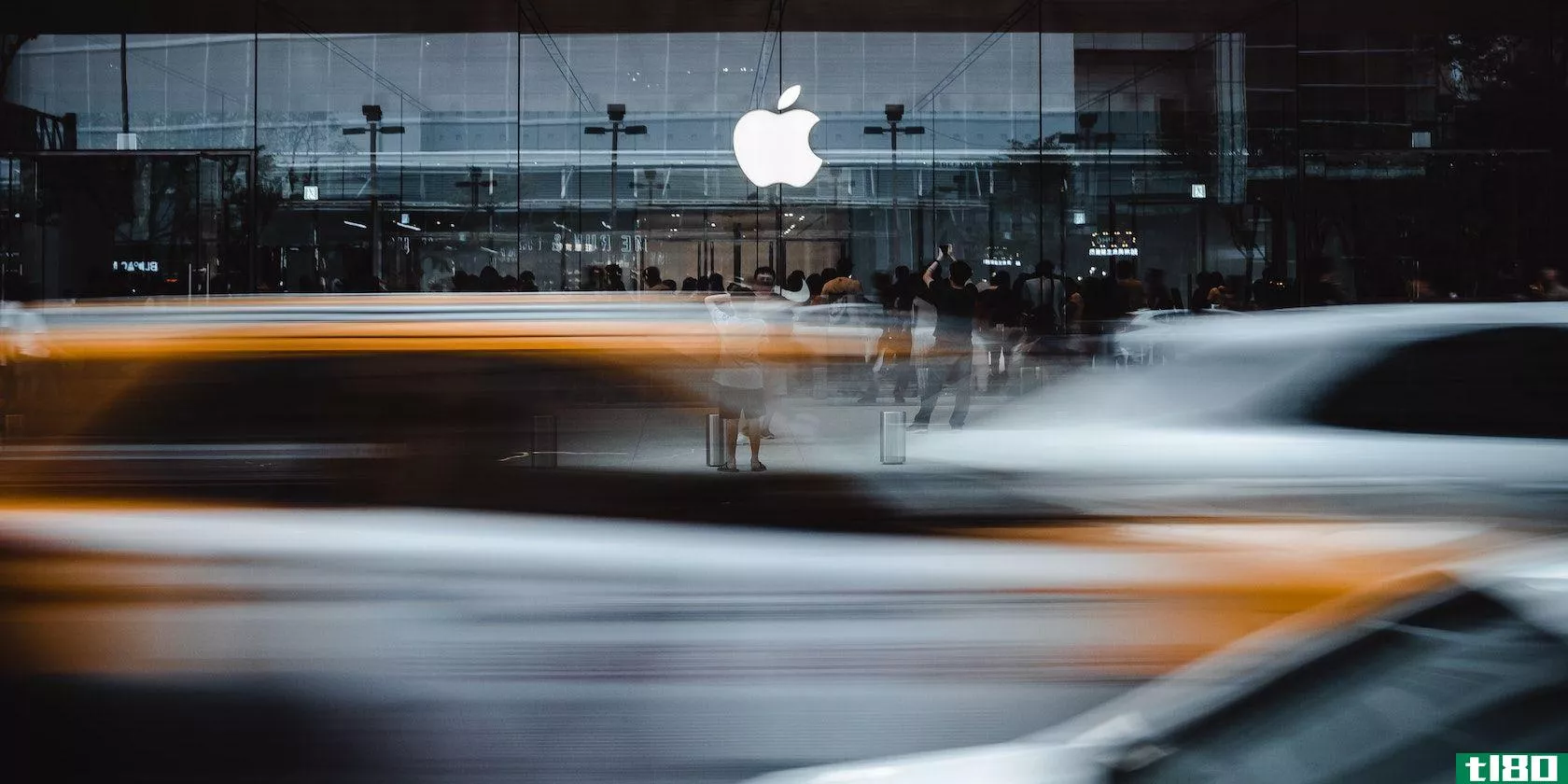 A photograph depicting a blurred vehicle outside an Apple store