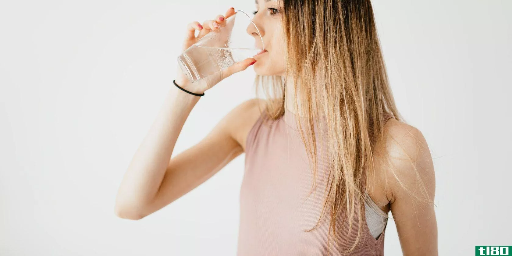 Woman in Pink Drinking Water w/ Right Hand