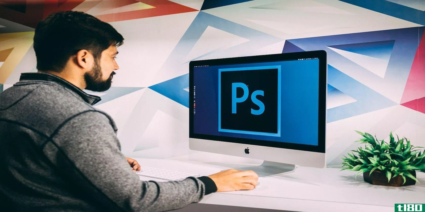 user using Adobe Photoshop on computer