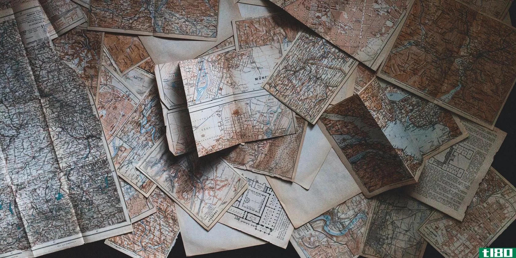 vintage maps open on a table featured