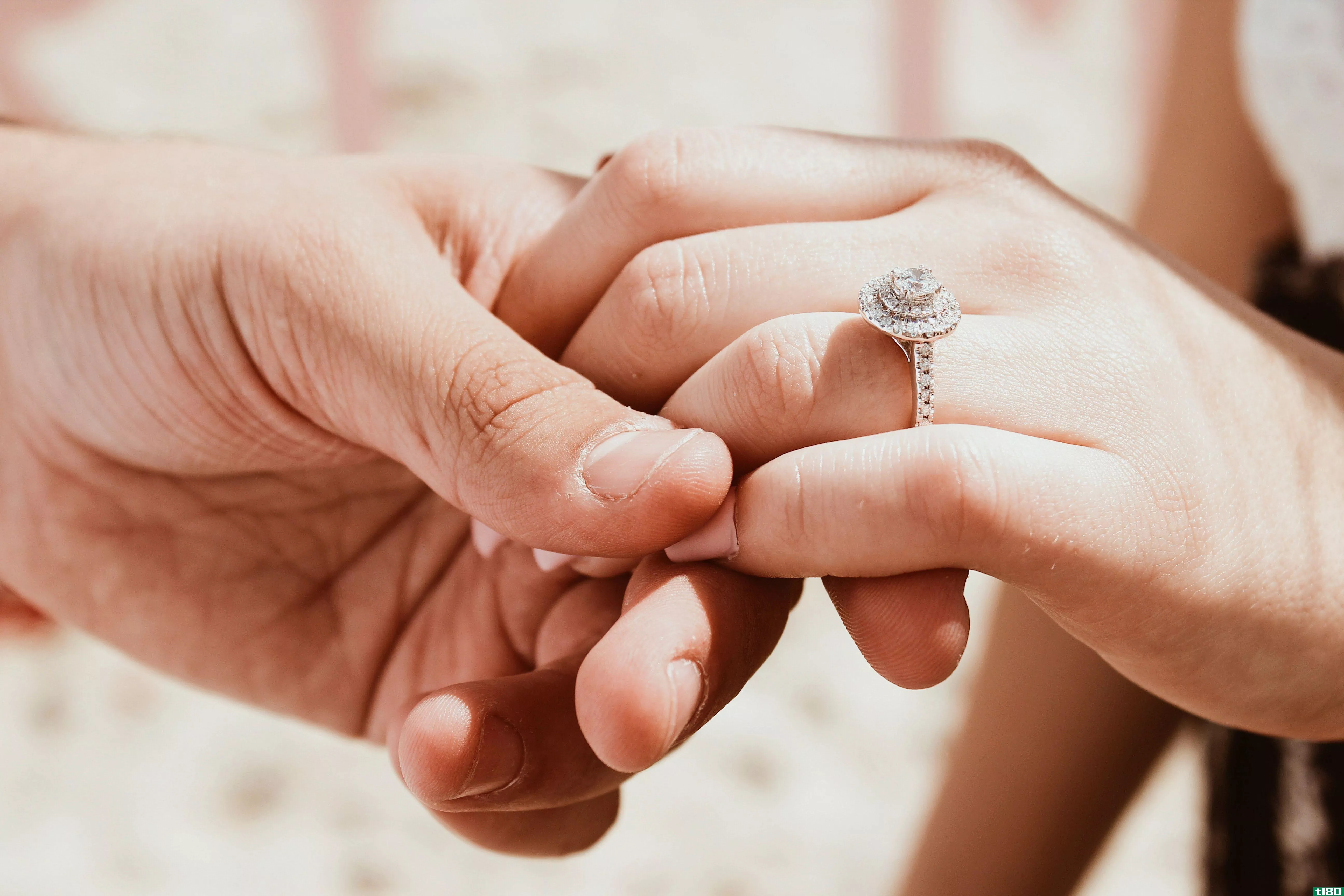 Hands held with wedding ring