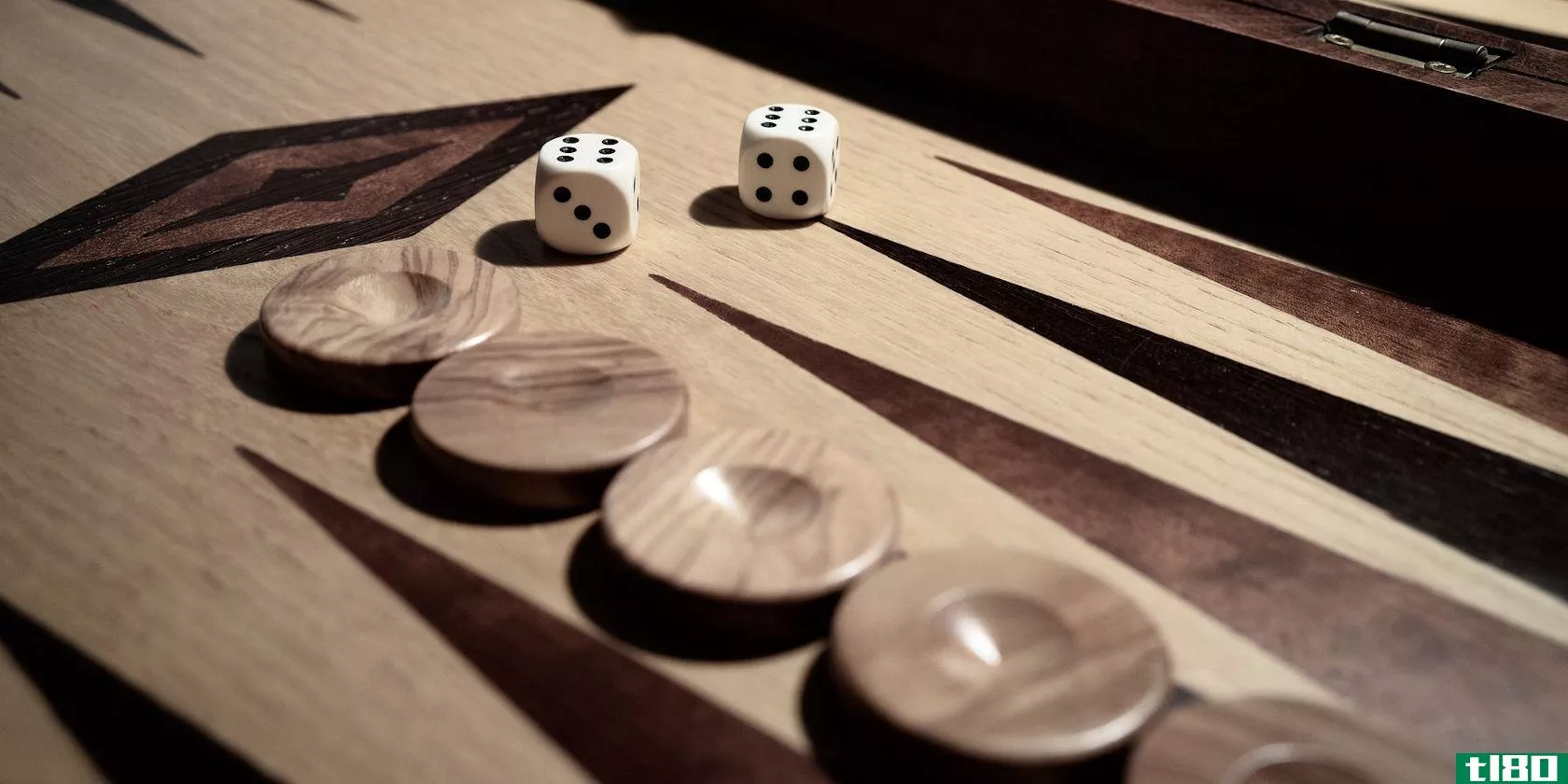 wooden backgammon board with dice and checkers