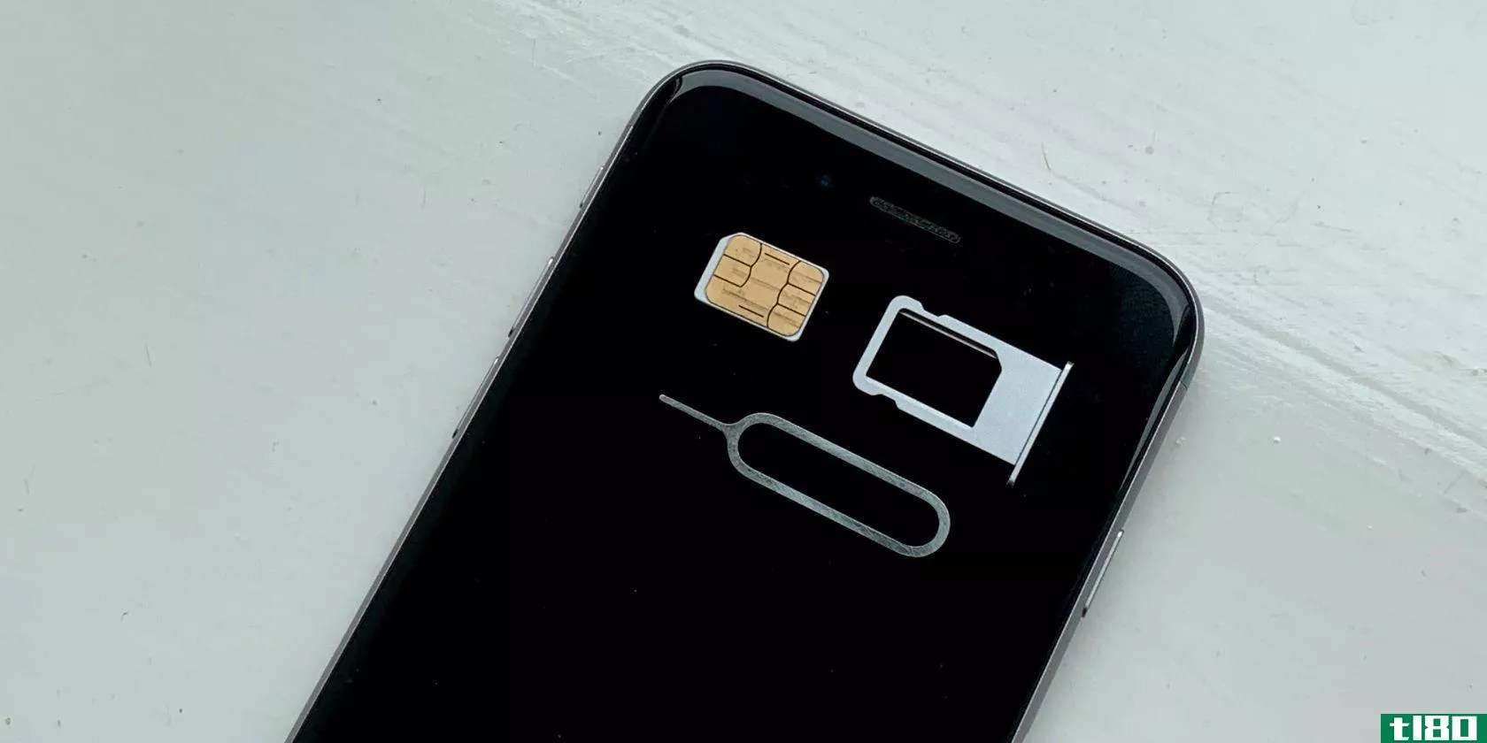 iPhone with SIM card SIM tray and removal pin