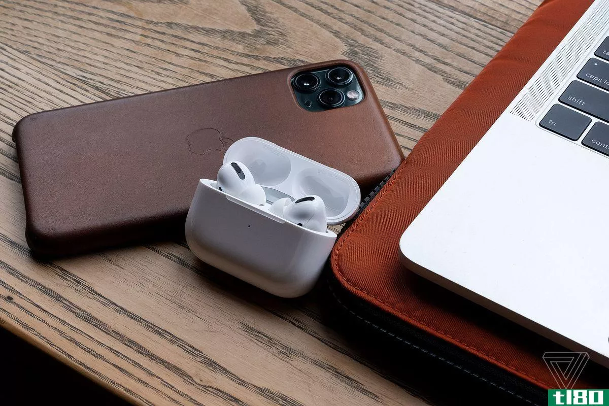 The AirPods Pro, the best wireless earbuds for people who use Apple products, pictured next to an iPhone 11 Pro Max and MacBook Pro.