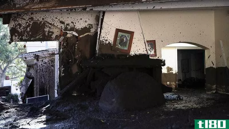  Mud fills a home that was destroyed by a mudslide
