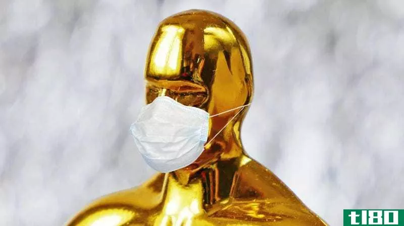 An image of an Oscar statuette wearing a tiny face mask
