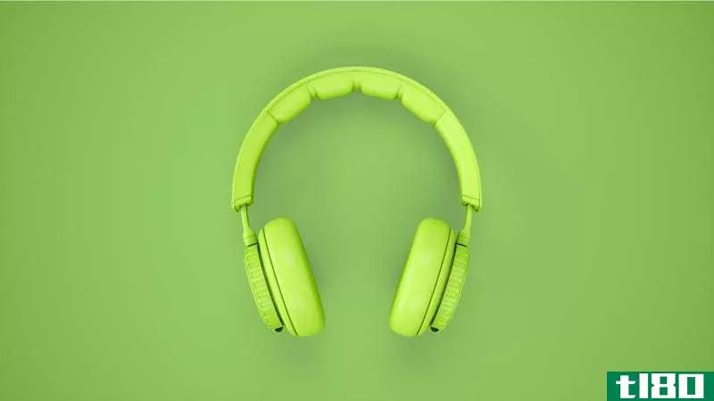 Green headphones on a green background