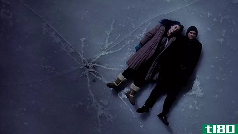 A screenshot from Eternal Sunshine of the Spotless Mind: Jim Carrey and Kate Winslet lying on a frozen lake