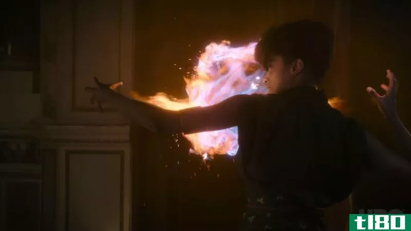 Screenshot from The Nevers of a woman creating a ball of magical flame with her hands