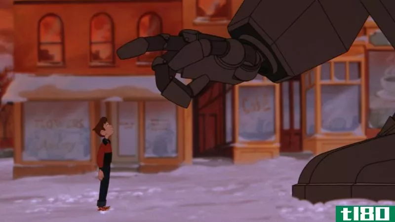 A screenshot from The Iron Giant with the Giant gently reaching out to Hogarth