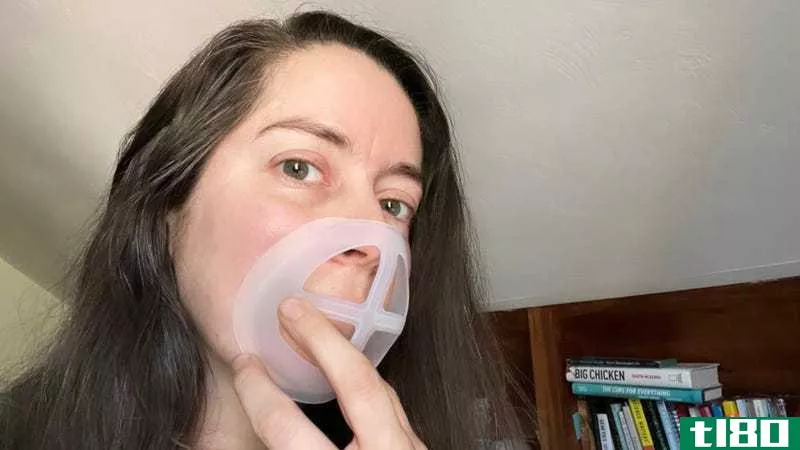 I'm holding a mask bracket against my face (no mask) to show where it fits