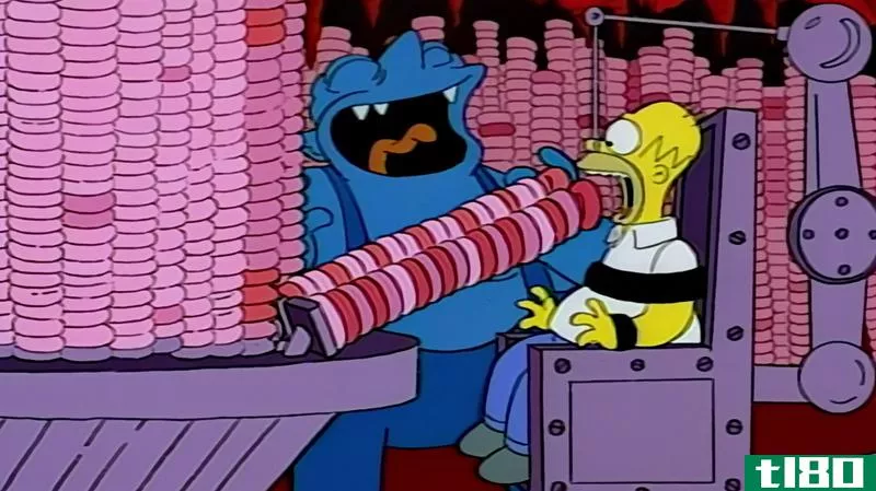 A screenshot from The Simps*** of Homer in hell being force-fed donuts