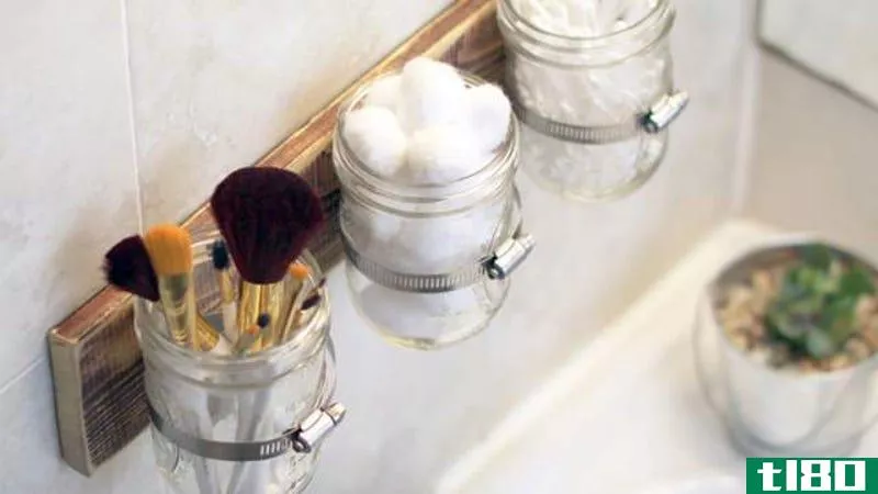 Illustration for article titled Free Up Bathroom Counter Space with Mounted Mason Jars