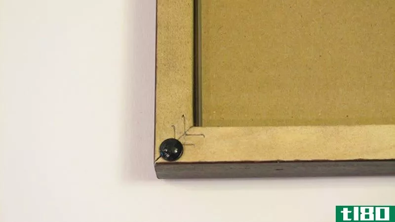 Illustration for article titled Use Rubber Feet to Keep Picture Frames Straight