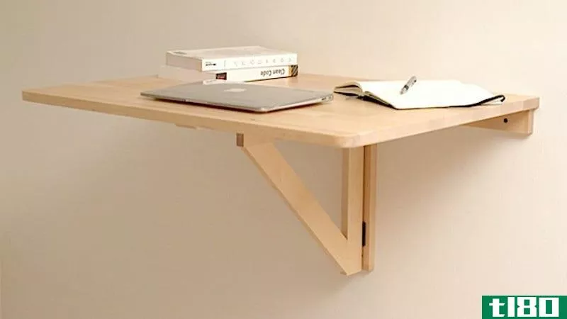 Illustration for article titled Repurpose a Wall Mounted Folding Table as a Collapsible Standing Desk