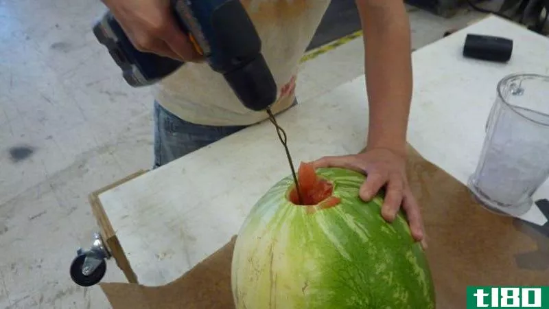 Illustration for article titled Make Watermelon Juice Using a Drill and Coat Hanger