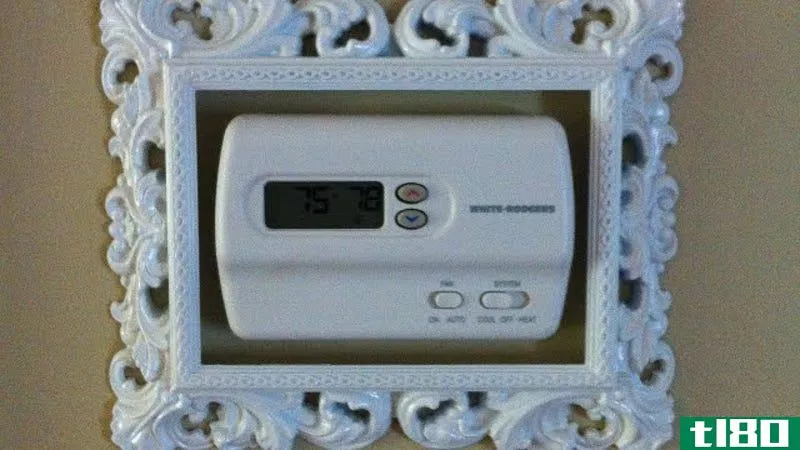 Illustration for article titled Disguise Ugly Thermostats with a Well-Placed Picture Frame