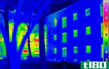 Difference Between Convection and Radiation - Thermogram of an Energy-efficient house in the foreground, radiating much less thermal energy compared to a traditional house radiating much more energy (background)
